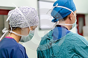 The doctor is wearing sterile surgical gown preoperative