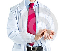 Doctor in white coat feeling his pulse