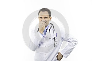 Doctor in white coat looking skeptic and scared, nervously bitting nails