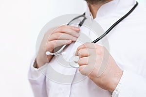 Doctor in a white coat with stethoscope, close up