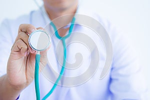 Doctor in white coat with stethoscope on white background for he