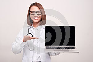 Doctor woma holding laptop on withe background