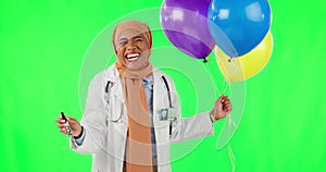 Doctor, woman and balloons with celebration green screen with hijab and happiness in medical care. Excited, female