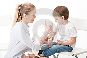 Doctor woman and child patient . Bandaging the hand with a bandage . Isolated white background .