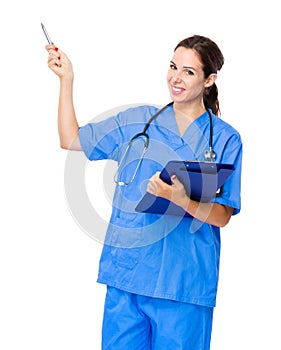Doctor woman with clipboard and pen up