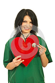 Doctor woman examine heart shape