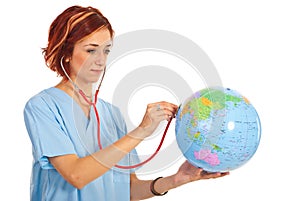 Doctor woman examine world globe