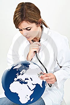 Doctor woman examine world globe with her stethoscope isolated o