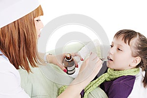 Doctor woman giving spoon dose of medicine liquid drinking syrup