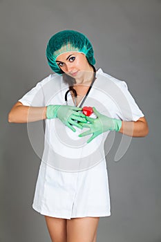Doctor woman on grey background girl medical staff heart medicine