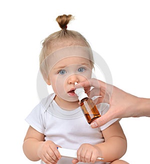 Doctor Woman hand using medicine nose spray nasal for baby toddler child kid