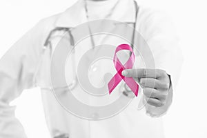 Doctor woman holding pink ribbon, of breast cancer awareness