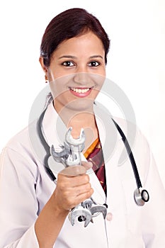 Doctor woman holding spanners