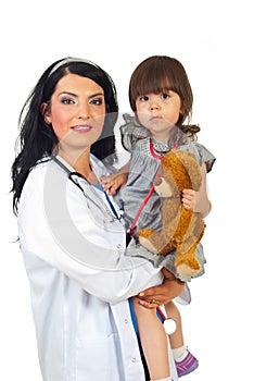 Doctor woman holding toddler girl