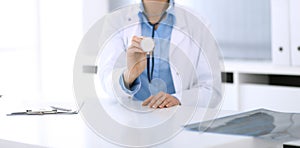 Doctor woman holds stethoscope head close-up. Physician ready to examine and help patient. Medical best treatment