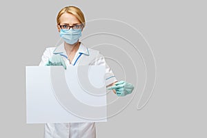 Doctor or woman nurse showing blank empty sign with copy space