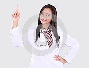 Doctor woman is pointing upwards