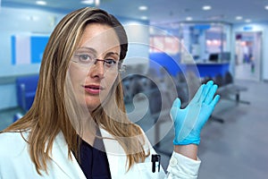 Doctor woman presenting and showing the entrance to the corridor