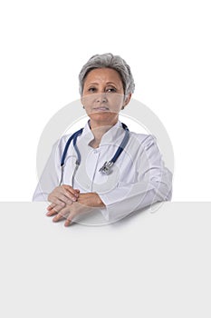 Doctor woman showing blank billboard