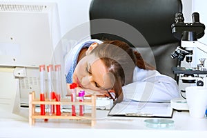 Doctor woman sleeping on office table