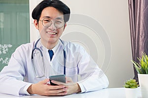 Doctor woman smiling using working with smart mobile phone