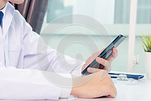 Doctor woman smiling using working with smart mobile phone