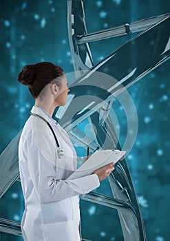 Doctor woman standing with 3D DNA strand against blue background