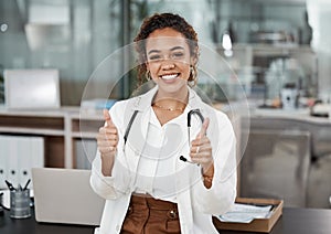 Doctor, woman and thumbs up portrait with healthcare and hospital success at clinic. Thank you, medical and professional