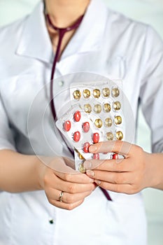 Doctor woman in white coat with tablet