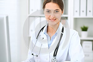 Doctor woman working at hospital. Closeup of stethoscope. Health care, insurance and help concept