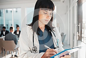 Doctor, woman and writing on checklist in hospital for research or wellness report. Healthcare clinic, planning and
