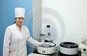 Doctor working with blood centrifuge