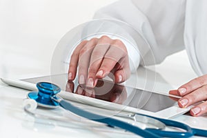 Doctor working with digital tablet computer