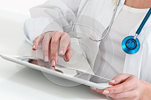 Doctor working with digital tablet computer