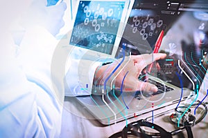 Doctor working with digital tablet and laptop computer with smart phone in medical workspace office and video conferance as