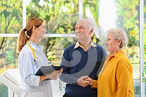 Doctor working with elderly patients photo