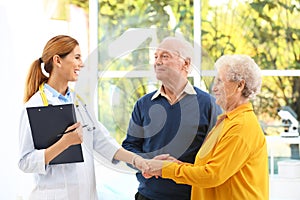 Doctor working with elderly patients photo