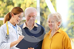 Doctor working with elderly patients photo