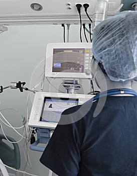 Doctor working with electronic equipment in the ICU