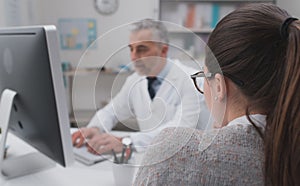 Doctor working with his computer