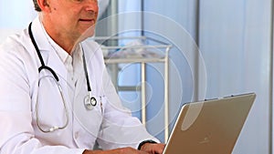 Doctor working on his laptop