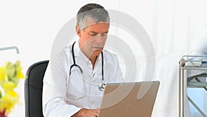 Doctor working on his laptop