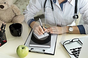 Doctor working in hospital writing a prescription, Healthcare and medical concept.