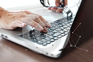 Doctor working with laptop computer in medical workspace office