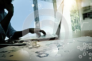 Doctor working with laptop computer in medical workspace office