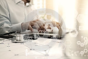 Doctor working with laptop computer in medical workspace office