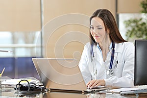 Doctor working on line in a consultation