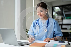 A doctor is working or making a video call medical consultation with a patient