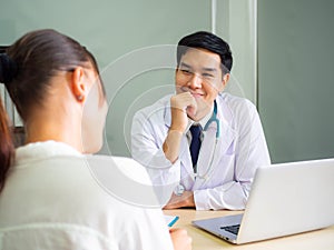 Doctor working in the office, Professional medical doctor sitting at desk in white uniform working in office