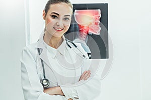 Doctor working with x ray film of patient head.